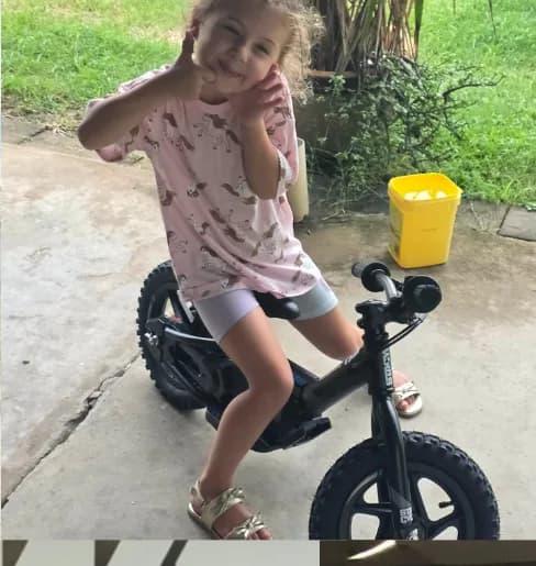 Girl with her balance bike